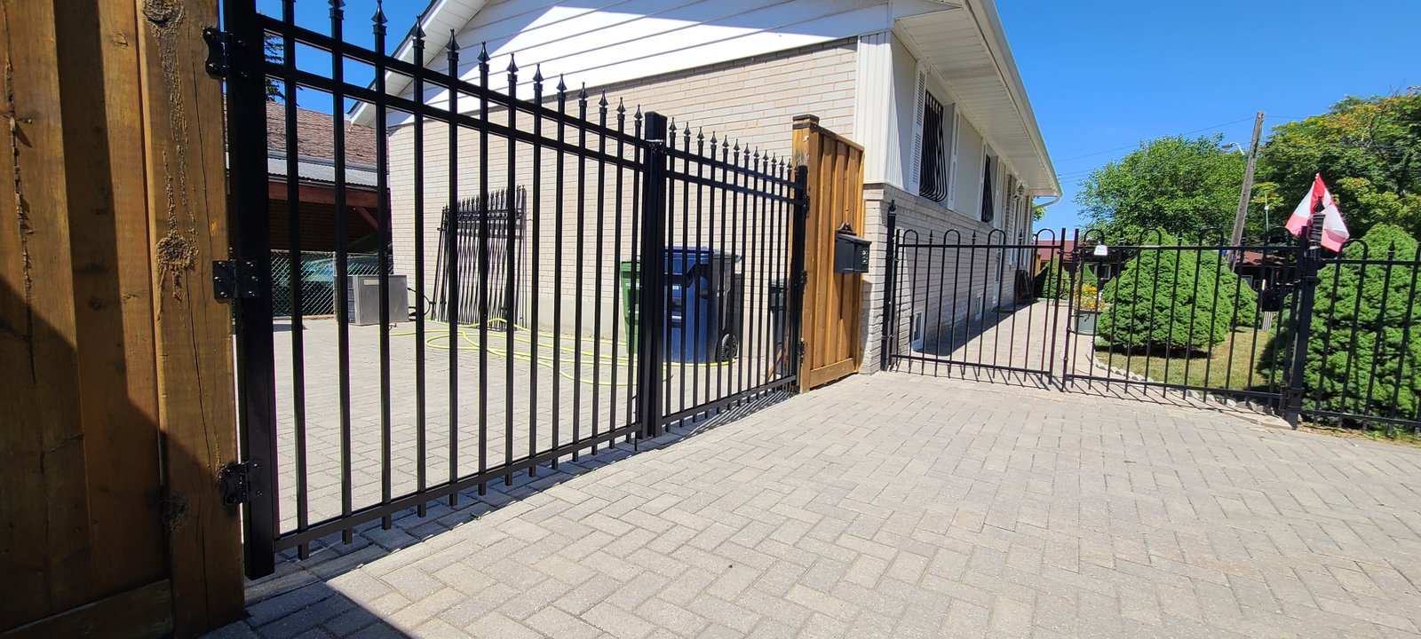 Premium custom black aluminum privacy fence installation on a luxury residential backyard perimeter