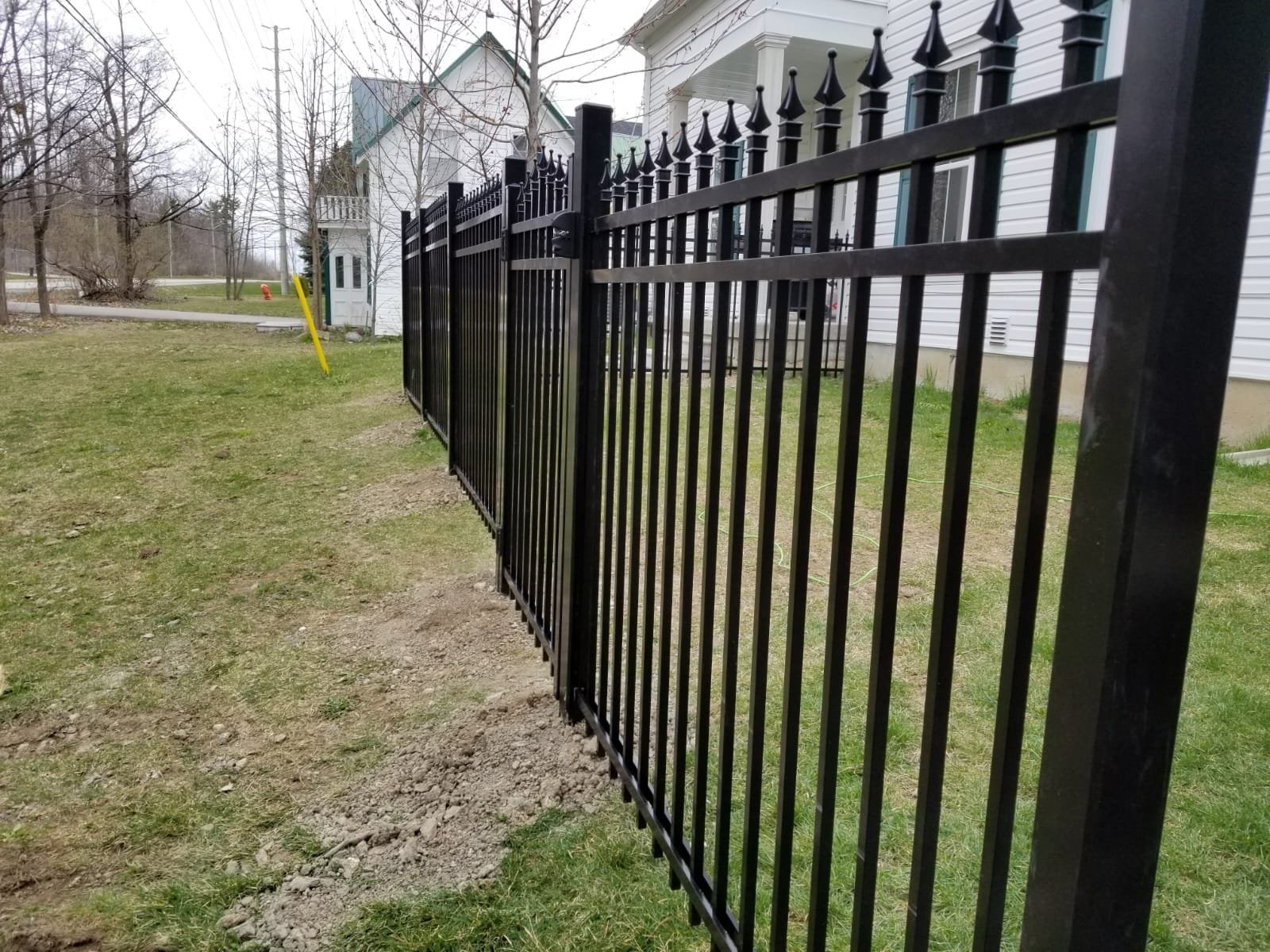 Close-up detail of architectural engineered aluminum fence panels showing structural powder coating