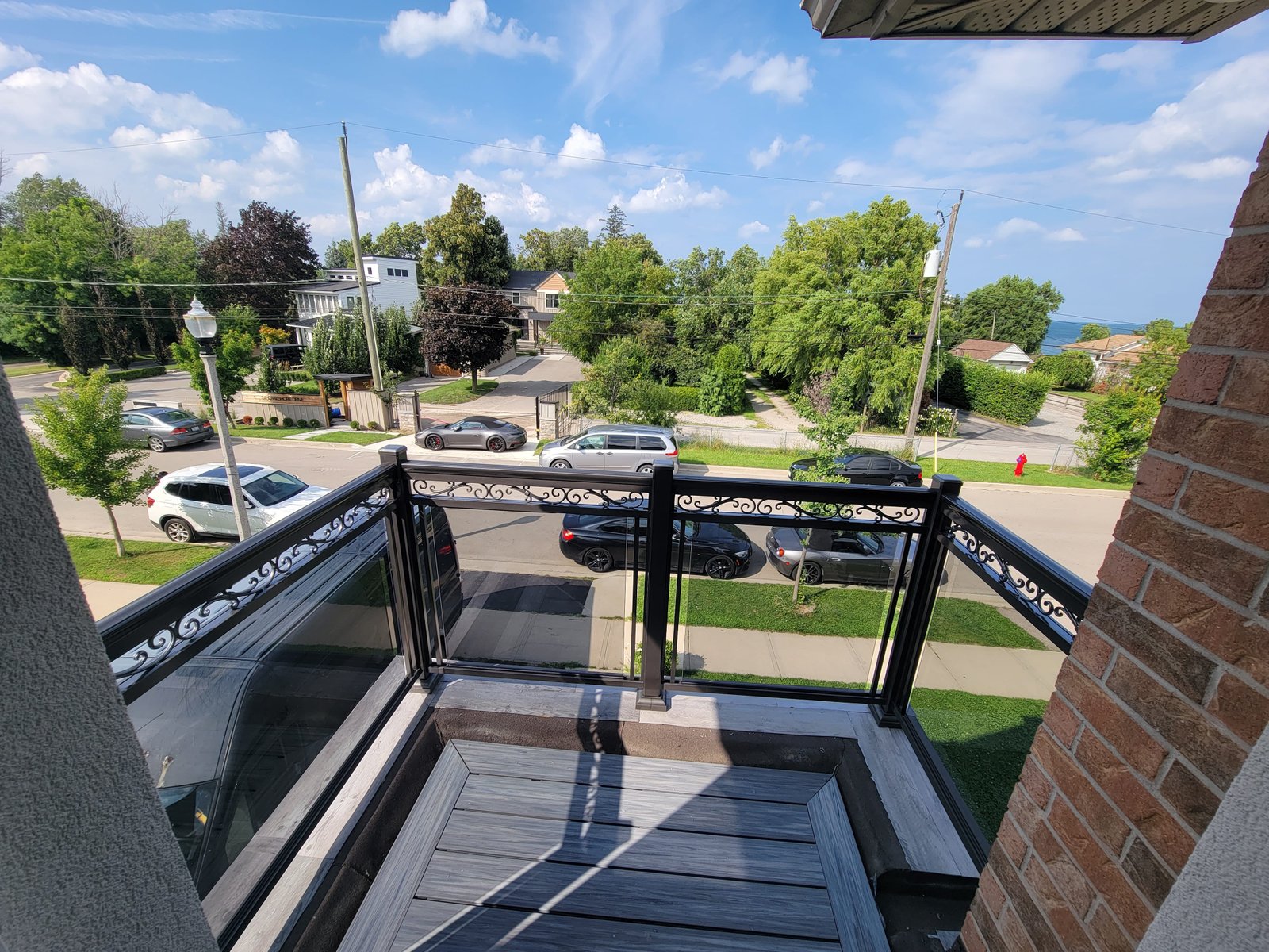 Custom glass and aluminum balcony railings on a luxury residential home